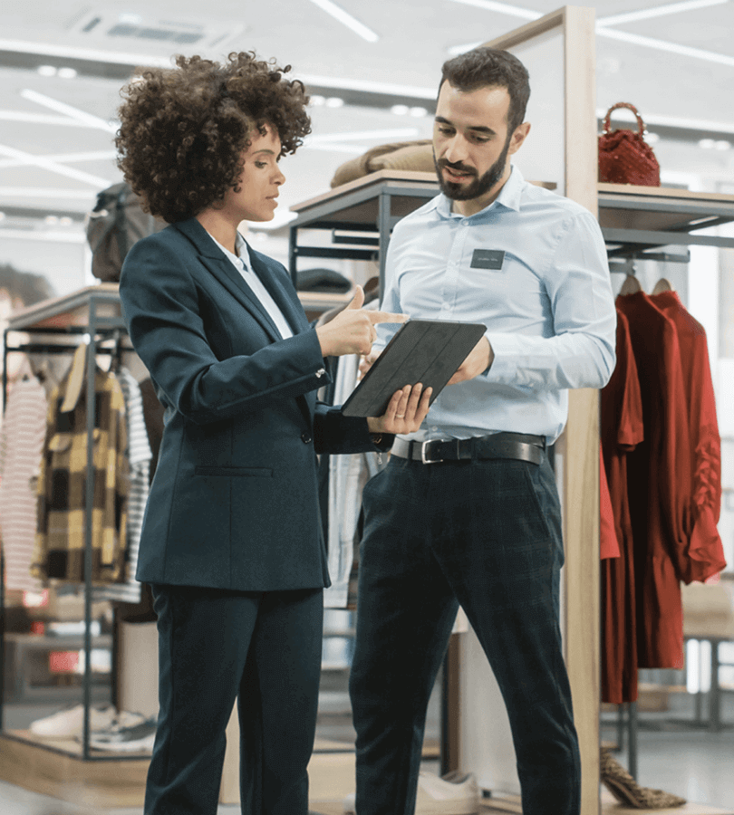 Retail professionals analyzing store-level insights